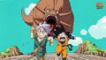 Goten and Trunks being chased by a dinosaur