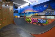 As-is-the-air-lounge-a-childrens-entertainment-center-with-virtual-golf-a-half-pipe-and-a-rock-climbing-wall