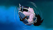 Turles dodges Goku's attack