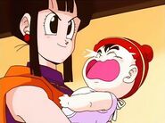 Gohan being holded by his mother.