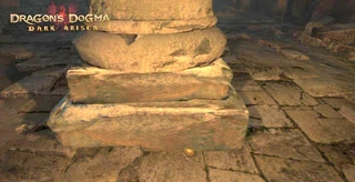 Dislodged badge at the base of the pillar