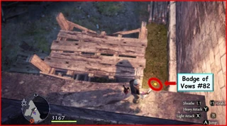 The badge on the other side of the wall to the right of Fournival Manor