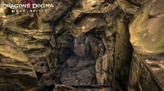 Badge (near center), on rock above path downwards