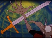 Sword pierces Mordroc's arm