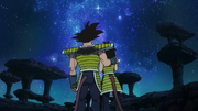 Bardock and his wife embrace as Kakarotto flies off.