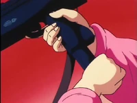 Bulma loads her machine gun.