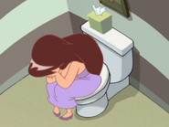 Clara crying on the toilet