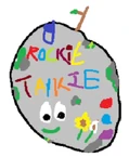 Microsoft Paint artwork created by Aimsey of a rock with a smile, flowers, colored spots, and the word "Rockie Talkie" written on it.