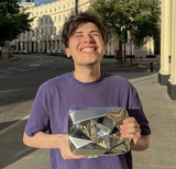 George holding his 10MIL Diamond Playbutton