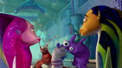 Crazy Joe using smooching puppets in front of Angie & Oscar