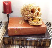 Bob the Skull with runes-on book stack