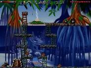 From the door, the secret is up the ladder one floor at the end of the ledge.