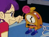 Arale hitting Mr. Time with the lollipop he gave her