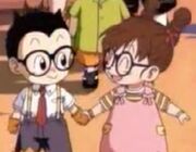 Arale holding Obtochaman holding their hand each other