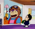 Obotchaman looking at a picture of Arale