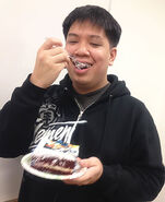 James Hata (Lead Designer of DMR-11) eating a piece of the cake.