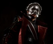 A masked Fenring observes the Prisoner