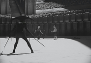 A Picador watches as Feyd fights Lanville