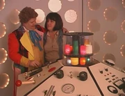 The Sixth Doctor (and Peri?) at the console.