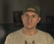 His appearance was changed in Patch 1.09 as he was given facial hair.