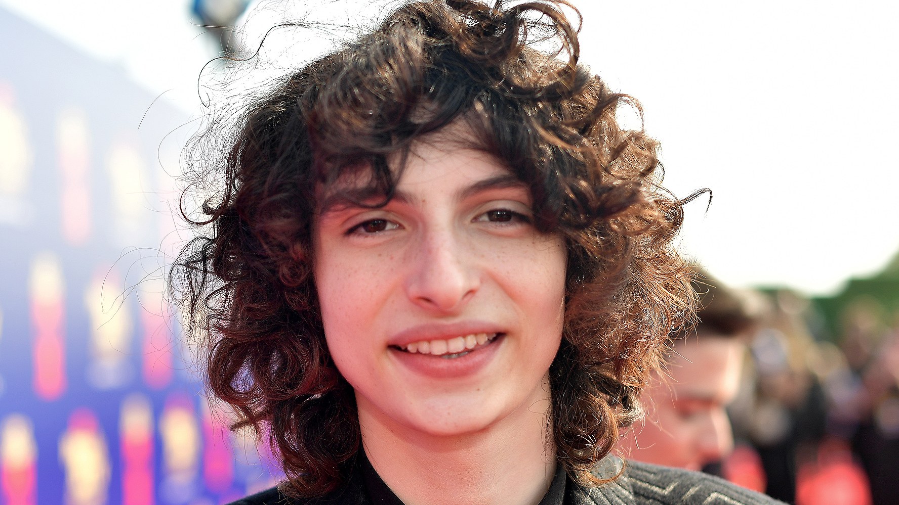 Finn wolfhard with a mullet