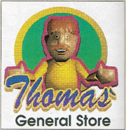 An advertisement from Dengeki Nintendo 64 magazine for Thomas's Bazaar, which features Thomas as he would appear in EarthBound 64,