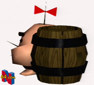 A Mr. Saturn behind a barrel, as it would appear in Earthbound 64