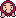 A Mr. Saturn's in-game Mother 3 sprite, wearing a magenta hood.