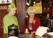 Elizabeth and Barbara.jpg (1.05 MB) Queen Elizabeth behind The Queen Victoria bar with Barbara Windsor