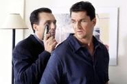 Dan being held at gunpoint by his fellow enemy Steve Owen (2000)