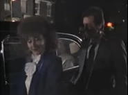 Angie says goodbye to Den and leaves the square.