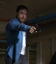 Lewis with a gun