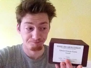 Matt holding Edd's ashes.