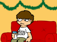 Edd chills out on the couch with milk.