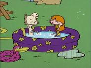 Sarah and Jimmy playing in a pool.