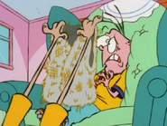 Rolf shows Eddy a vest made from his Papa's back hair.