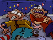 Edd and Eddy looking at Ed.