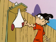 Edd tries to hit the punching bag.