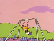 Nazz swinging on the playground.