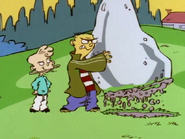 Jimmy gets Ed to lift a heavy boulder for him.