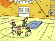 The Eds standing around as Ed swings.