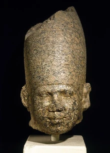 Pink granite head possibly depicting Huni at the 