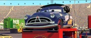 Doc como el jefe de pits de McQueen.