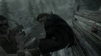 Ulfric's first appearance in the game—sitting alongside the Dragonborn in a wagon to be executed Helgen.