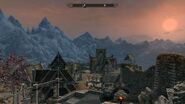 The view looking down on Whiterun from the steps of Dragonreach.