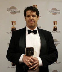 Guy Moon with a Annie Award