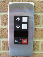 Otis Series 1 call button with Fire Service keyswitch.