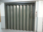 Modernize Otis traction freight elevator with accordion folding gate which using Dewhurst US90.