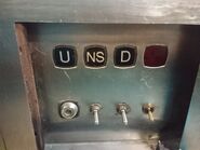 1991 Kone service elevator with both "up" and "down" M-Series buttons. Notice that they are symbols instead of letterings.