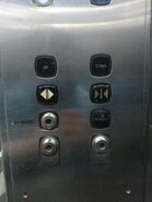 1986 Kone service elevator with both "up" and "down" M-Series buttons. Notice that they are letterings instead of symbols.